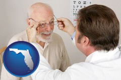 florida map icon and an optician fitting eyeglasses on an elderly patient
