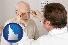 idaho map icon and an optician fitting eyeglasses on an elderly patient