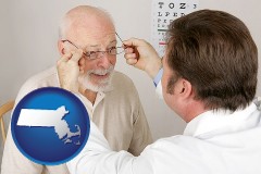massachusetts map icon and an optician fitting eyeglasses on an elderly patient