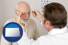north-dakota map icon and an optician fitting eyeglasses on an elderly patient