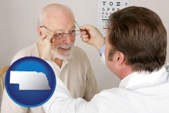 nebraska map icon and an optician fitting eyeglasses on an elderly patient