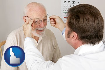 an optician fitting eyeglasses on an elderly patient - with Idaho icon