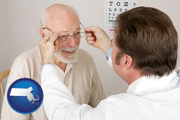an optician fitting eyeglasses on an elderly patient - with Massachusetts icon